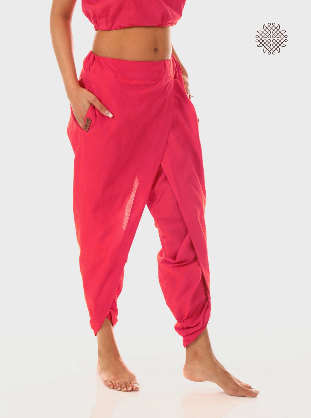 pAtala (coral pink) taruNi, cross-cut dhoti pants with pockets crafted in 100% cotton
