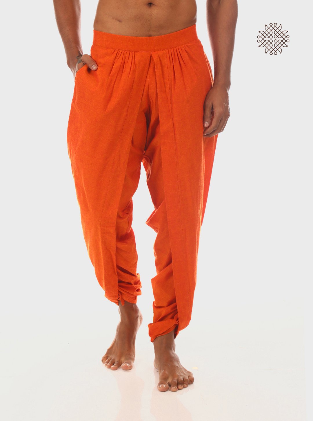 Kesari (saffron) tulip yuvaka dhoti pants with pockets crafted in 100% cotton