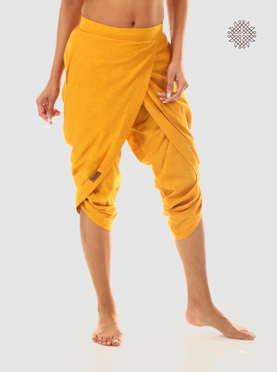haridra (mustard yellow) taruNi, cross-cut calf length dhoti pants with pockets crafted in 100% cotton