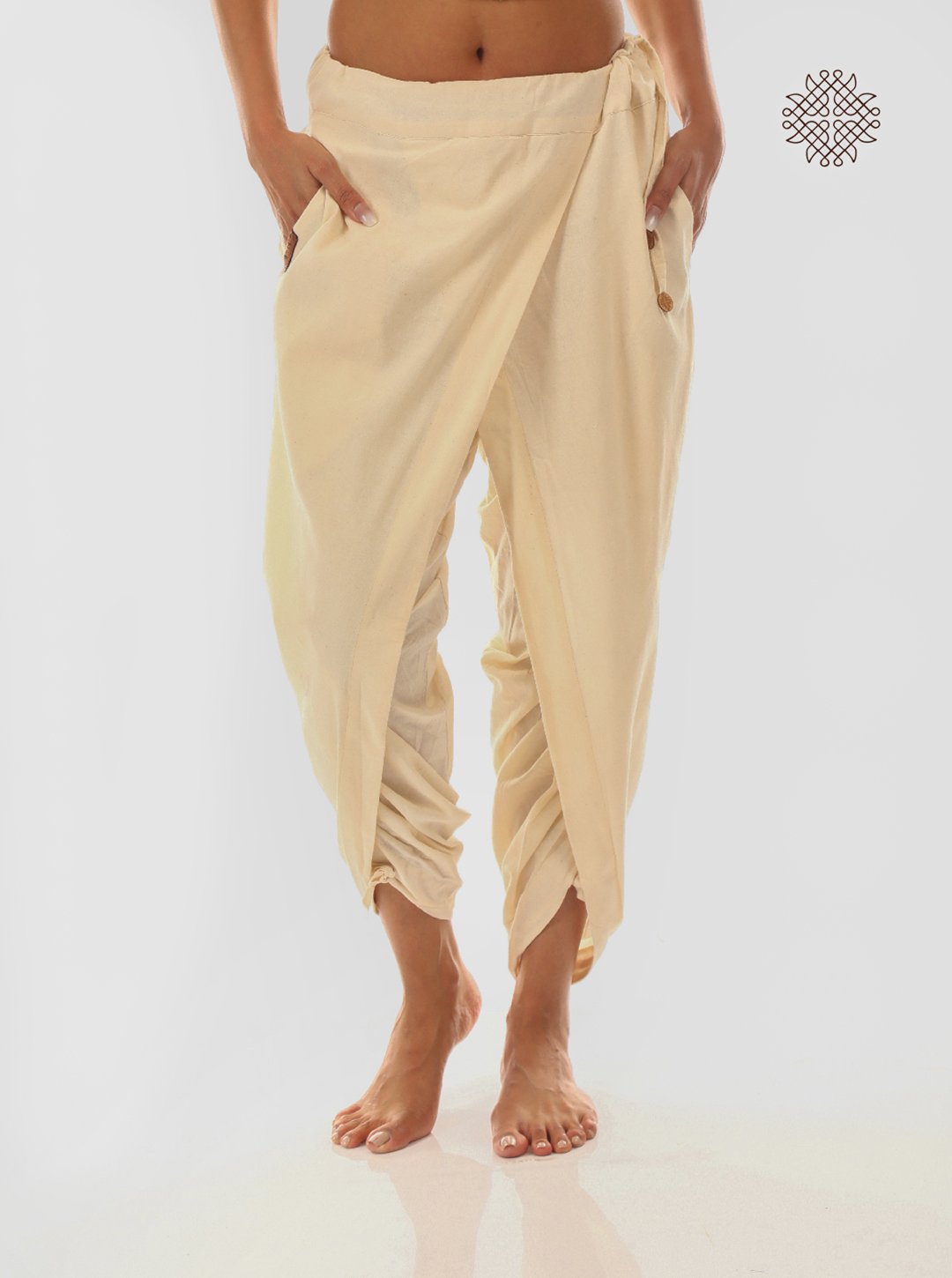 sattvika (off-white) yuvaki, cross-cut dhoti pants with pockets crafted in 100% cotton
